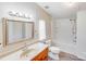 Clean bathroom featuring a shower-tub combo and traditional vanity with a large mirror at 4408 Robins Nest Rd, Concord, NC 28027