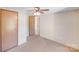 This bedroom has carpet floors, a ceiling fan, and closet space at 4408 Robins Nest Rd, Concord, NC 28027