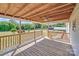 The home features a spacious wood deck with a fan and railings overlooking the backyard at 4408 Robins Nest Rd, Concord, NC 28027