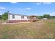 The home features a backyard and deck perfect for outdoor entertaining at 4408 Robins Nest Rd, Concord, NC 28027