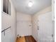 Practical laundry area with shelving and a door, providing convenient access and storage at 4408 Robins Nest Rd, Concord, NC 28027