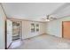 Well-lit living room with an open door leading to a view of the front yard at 4408 Robins Nest Rd, Concord, NC 28027