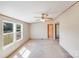Bright living room featuring carpeting, ceiling fan, and backyard view at 4408 Robins Nest Rd, Concord, NC 28027