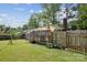 View of the backyard, deck, and fenced perimeter at 6412 Old Meadow Rd # 69, Charlotte, NC 28227