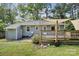 Well-maintained backyard featuring a deck, patio, and ample space at 6412 Old Meadow Rd # 69, Charlotte, NC 28227