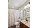 Updated bathroom featuring vanity and floral shower curtain at 6412 Old Meadow Rd # 69, Charlotte, NC 28227