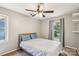 Bright bedroom featuring ample natural light, a ceiling fan, and neutral tones for a cozy atmosphere at 6412 Old Meadow Rd # 69, Charlotte, NC 28227