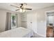 Bright bedroom with plenty of natural light, a ceiling fan, and closet space for organized living at 6412 Old Meadow Rd # 69, Charlotte, NC 28227