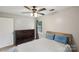 Cozy bedroom with a ceiling fan and a classic wooden dresser at 6412 Old Meadow Rd # 69, Charlotte, NC 28227