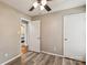 Cozy bedroom with warm tones, closet, and view to another room, offering a comfortable living space at 6412 Old Meadow Rd # 69, Charlotte, NC 28227