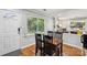 Bright dining area with wood floors, a view to the backyard, and access to the living room at 6412 Old Meadow Rd # 69, Charlotte, NC 28227