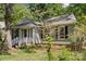 Single-story home featuring gray siding, black shutters, and a well-maintained front yard at 6412 Old Meadow Rd # 69, Charlotte, NC 28227