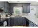 Modern kitchen features gray cabinets, mosaic backsplash, and stainless steel appliances at 6412 Old Meadow Rd # 69, Charlotte, NC 28227