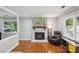 Bright living room with fireplace and large windows, creating a welcoming atmosphere at 6412 Old Meadow Rd # 69, Charlotte, NC 28227