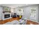 Inviting living room with a cozy fireplace, wood floors, and neutral paint for a bright, comfortable feel at 6412 Old Meadow Rd # 69, Charlotte, NC 28227