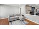 Spacious living room with hardwood floors, sectional sofa, and open layout at 6412 Old Meadow Rd # 69, Charlotte, NC 28227