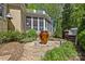 Large backyard decorative fountain with a screened-in porch and outdoor grilling area at 6914 Riesman Ln # 95, Charlotte, NC 28210