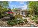 Expansive backyard with a multi-level deck, patio, and lush gardens create a private oasis for outdoor living at 6914 Riesman Ln # 95, Charlotte, NC 28210
