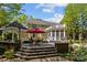 Multi-level deck and patio offer ample space for outdoor enjoyment, complementing the home's architecture and lush landscaping at 6914 Riesman Ln # 95, Charlotte, NC 28210