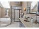 Luxury bathroom with a walk-in shower, soaking tub, granite vanity and a neutral color palette at 6914 Riesman Ln # 95, Charlotte, NC 28210