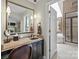 Modern bathroom with a granite vanity, vessel sink, and a view of the shower and tub at 6914 Riesman Ln # 95, Charlotte, NC 28210