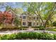 Charming two-story home featuring a manicured lawn, fountains, and lush landscaping in a desirable neighborhood at 6914 Riesman Ln # 95, Charlotte, NC 28210