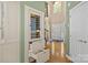 Hallway featuring a wine cooler, high ceilings, and a view of the front door at 6914 Riesman Ln # 95, Charlotte, NC 28210