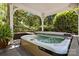 Relax in this secluded, covered hot tub spa, surrounded by mature trees and privacy landscaping at 6914 Riesman Ln # 95, Charlotte, NC 28210