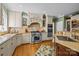 Spacious kitchen boasts custom cabinetry, granite countertops, a stainless steel stove, and hardwood flooring at 6914 Riesman Ln # 95, Charlotte, NC 28210