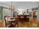 Expansive kitchen with a wooden island, granite counters, stainless steel appliances, and a nearby dining area at 6914 Riesman Ln # 95, Charlotte, NC 28210