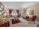 An inviting living room with a staircase, showcasing elegant furnishings and abundant natural light at 6914 Riesman Ln # 95, Charlotte, NC 28210