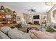 Spacious living room with fireplace, plush seating, and classic decor, ideal for Gathering gatherings at 6914 Riesman Ln # 95, Charlotte, NC 28210
