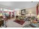 An elegant living room showcasing sophisticated decor, complemented by an adjacent dining area for seamless entertaining at 6914 Riesman Ln # 95, Charlotte, NC 28210