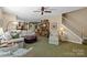 Open-concept living room with seamless flow to kitchen, features a fireplace and comfortable seating at 6914 Riesman Ln # 95, Charlotte, NC 28210