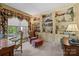 Well-appointed home office with custom built-ins, large window, and elegant furnishings at 6914 Riesman Ln # 95, Charlotte, NC 28210