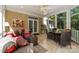 Bright sunroom with tile flooring, comfortable seating, and ample natural light makes a relaxing space at 6914 Riesman Ln # 95, Charlotte, NC 28210