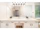 Bathroom with double vanity, large mirror, and great lighting at 7106 Kinsmore Ln, Charlotte, NC 28269