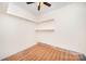 Spacious and bright bonus room with hardwood floors and built-in shelves at 7106 Kinsmore Ln, Charlotte, NC 28269