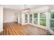 Bright dining area with laminate flooring, modern lighting, and expansive windows, creating a perfect setting for Gathering meals at 7106 Kinsmore Ln, Charlotte, NC 28269