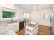Eat-in kitchen area showcases granite countertops, stainless sink, and views of the backyard at 7106 Kinsmore Ln, Charlotte, NC 28269