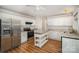 Bright kitchen features stainless steel appliances, white cabinets, and granite countertops at 7106 Kinsmore Ln, Charlotte, NC 28269