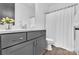 Bathroom featuring gray cabinets, quartz countertop, modern fixtures, and a shower with a curtain for privacy at 8136 Energy Ln, Catawba, NC 28609