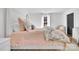 Charming bedroom featuring a cozy bed with floral bedding, a small sitting chair, and a window for natural light at 8136 Energy Ln, Catawba, NC 28609