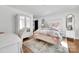 Bright bedroom with a mirrored wardrobe, floral bedding, and a vanity, creating a stylish and functional space at 8136 Energy Ln, Catawba, NC 28609