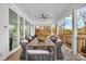 Outdoor covered deck featuring a dining table with seating and a ceiling fan for added comfort and style at 8136 Energy Ln, Catawba, NC 28609