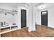Bright entryway featuring hardwood floors, a coat rack, and a view of the front door at 8136 Energy Ln, Catawba, NC 28609