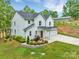 Stunning two-story home featuring a well-manicured front yard, 2-car garage, and modern architecture at 8136 Energy Ln, Catawba, NC 28609