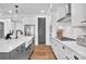 Bright and modern kitchen featuring white cabinets, stainless steel appliances, and hardwood floors at 8136 Energy Ln, Catawba, NC 28609