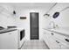 Well-organized laundry room with modern washer, dryer, patterned floor tiles, sink and storage, combining style and functionality at 8136 Energy Ln, Catawba, NC 28609