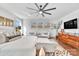 Bright main bedroom featuring a ceiling fan, large windows, hardwood floors and contemporary decor at 8136 Energy Ln, Catawba, NC 28609